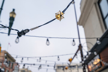 Electric bulbs christmas decorations over city streets