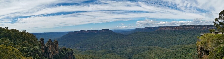 Obraz na płótnie Canvas Beautiful panoramic view of tall mountains and deep valleys, Three Sisters Lookout, Blue Mountain National Park, New South Wales, Australia 