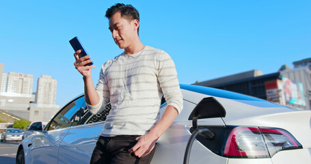 man Charges electric car © ryanking999