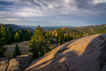 This is early morning in the wilderness of Lassen Volcanic National Park in northern California. Morning shadows and sun on the mountains can be seen.