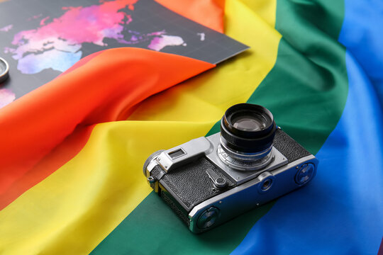Rainbow LGBT flag, camera and world map