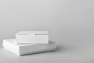 Blank cardboard boxes on light background