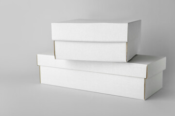 Blank cardboard boxes on light background
