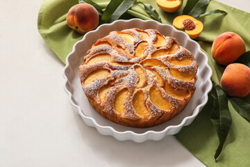 Composition with tasty peach pie on white background