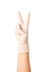 Hand in protective glove showing victory gesture on white background