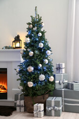 Interior of living room with beautiful Christmas tree and fireplace