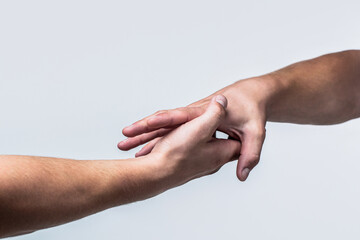Two hands, helping arm of a friend, teamwork. Rescue, helping gesture or hands. Close up help hand....