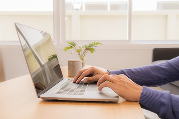 Fototapeta premium Asian Business Using Laptop Computer Online Working from Home