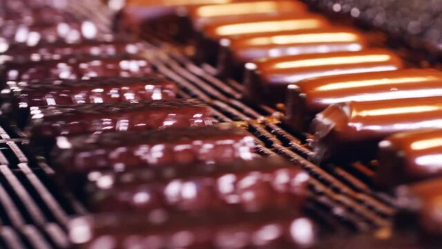 Factory machine is congealing glaze on sweets
