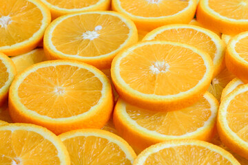 Texture of sliced orange, fresh and healthy fruit, which is rich in juice and vitamin c. Orange background.