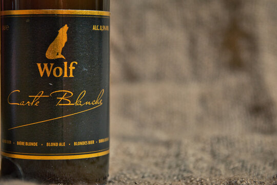 Wolf Carte Blance Belgian speciality beer from brewery De Koninck. Close-up of bottle and label.