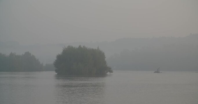 Morning sunrise with a mist on the Drava River