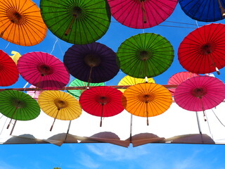 Fototapeta na wymiar Colorful fabric umbrella, Famous decoration item in festival or ceremony. Abstract idea of alternative sexual concept. 