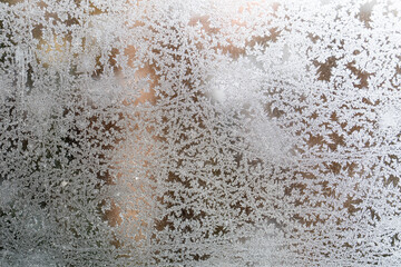 Ice flower on the window. Heating and saving money concept. Texture, cold and energy efficiency