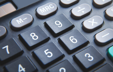 Black calculator keyboard. Closeup. Business