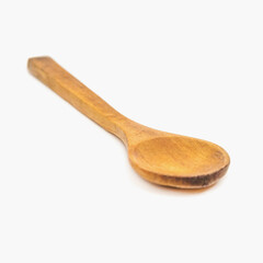 Small wooden spoon isolated on white background