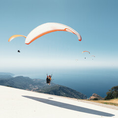 Group of brave paragliders takeoff from mount Babadag near the resort of Oludeniz. The most popular spot for air sports and recreation in Turkey