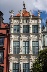 Fototapeta na wymiar The facade of the restored Gdansk patrician house in the Long Market. Pomerania, Poland