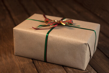 Gift. Christmas and New Year. Bow and packing tape. Valentine's Day On a wooden background.