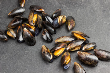 Mussels are scattered on table. Shellfish seafood