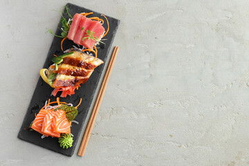 Sashimi sushi of salmon, eel and tuna served on plate