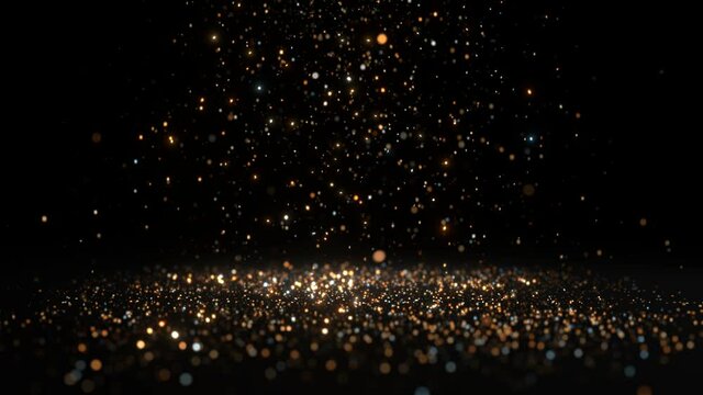 Glittering golden particles falling from the sky against a dark background.