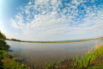 lake in forest in autumn with forest in the background