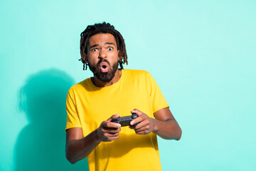 Photo of young unhappy upset disappointed african man lost in video game play playstration isolated...