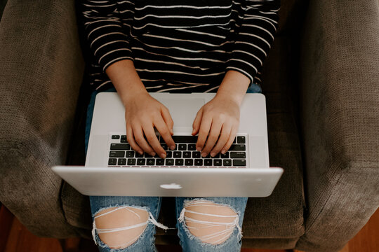 BALI, INDONESIA - Nov 20, 2019: Young Woman Using Apple Macbook