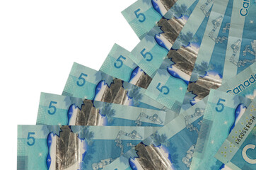5 Canadian dollars bills lies in different order isolated on white. Local banking or money making concept