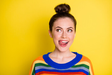 Photo of young beautiful playful girl show tongue lick lips dreamy look empty space isolated over yellow color background - obrazy, fototapety, plakaty