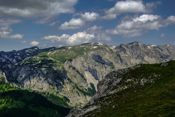 Obraz premium wonderful mountains with lot of green and clouds on the sky