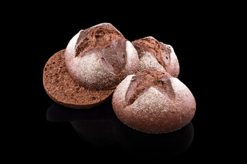 Freshly baked homemade bread isolated on black. Fresh dark rue bread. Healthy eating and traditional bakery, baking bread concept