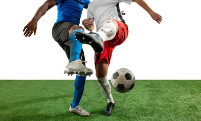 Obraz na płótnie Canvas Close up legs of professional soccer, football players fighting for ball on field isolated on white background. Concept of action, motion, high tensioned emotion during game. Cropped image.