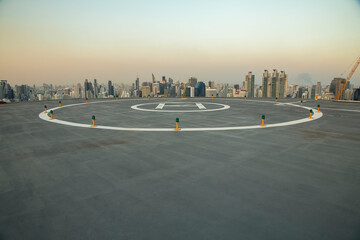  Heli Copter parking lot on the deck at sunset in the capital of Thailand. Space for helicopter landing on high-rise buildings in Bangkok, Thailand.