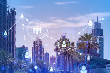 Panoramic view skyscrapers. Modern cityscape of the capital of the Emirate of Dubai. Recruitment and social relation concept. Double exposure.