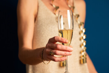 woman holding champagne glass New Year's eve party