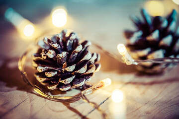 pine cone and christmas lights holiday background
