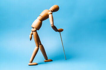 elderly man with a walking stick. The concept of approaching old age.