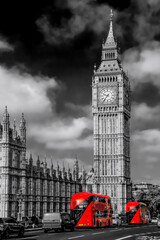 Fototapeta na wymiar Big Ben with red buses on the bridge during sunny day in London, England, UK