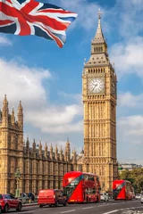 Foto op Plexiglas Big Ben with red buses on the bridge against flag of England in London, England, UK © Tomas Marek