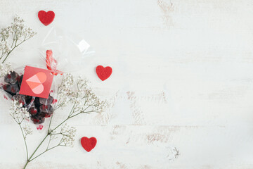 copy space and chocolates bag with hearts and flowers