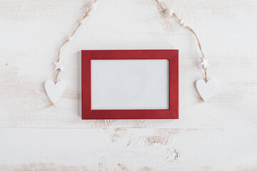red frame with white wooden hearts