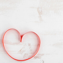 red tie creating heart