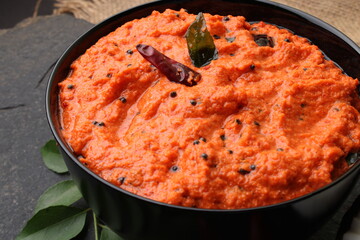 bowl of indian red chutney, coconut chutney.