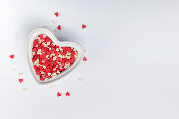 Heart shaped bowl filled with sugar sprinkles