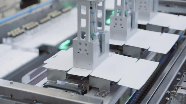 Food factory. Automation line. Industrial factory indoors machinery. Packing boxes.