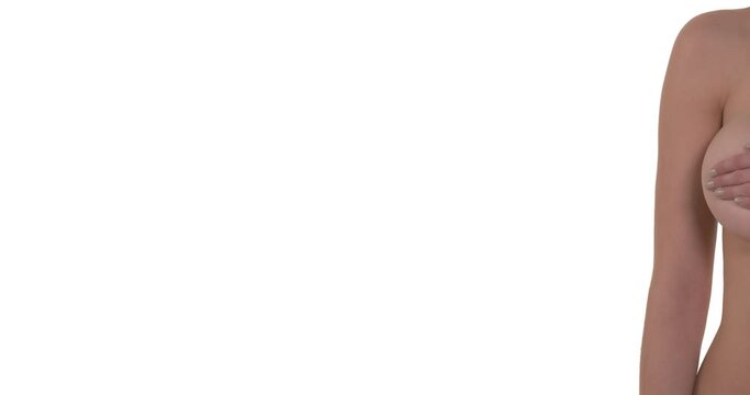 Panning camera of a woman with naked bust covering her breast. Isolated on white background. Copy Space. Beauty and healthcare concept.
