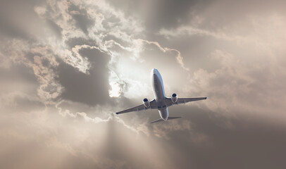 Fototapeta na wymiar Airplane in the sky at sunset
