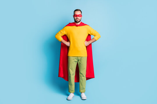 Full length body size photo of superhero wearing costume mask isolated on bright blue color background